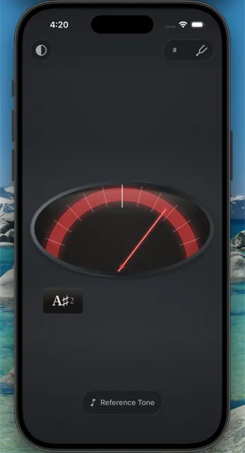 Needle Tune app showing a dark analog dial tuner with a red glowing needle and the note A#2 displayed.